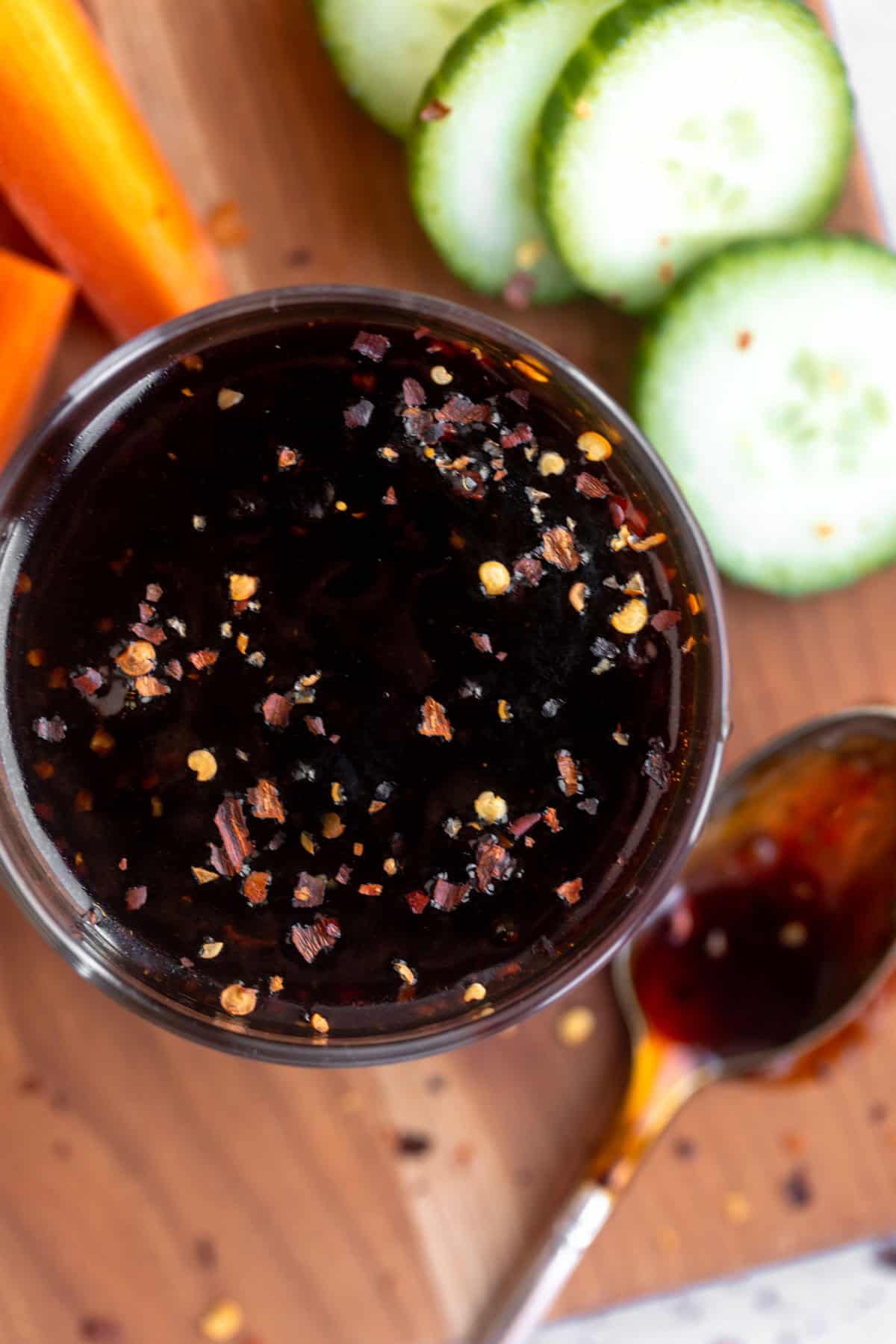 gluten free teriyaki sauce in a jar with veggies and red pepper flakes