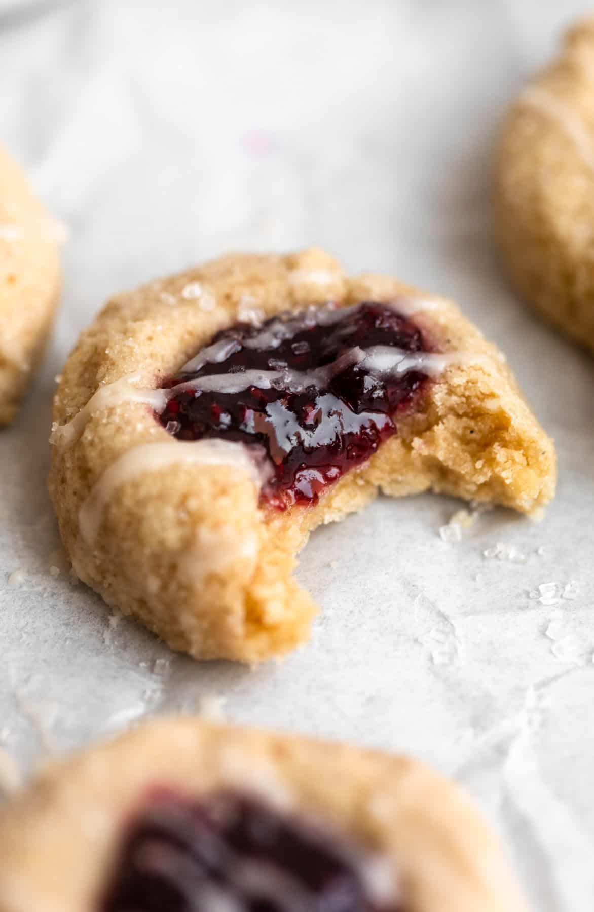 gluten free thumbprint cookies with a bite taken out to show texture
