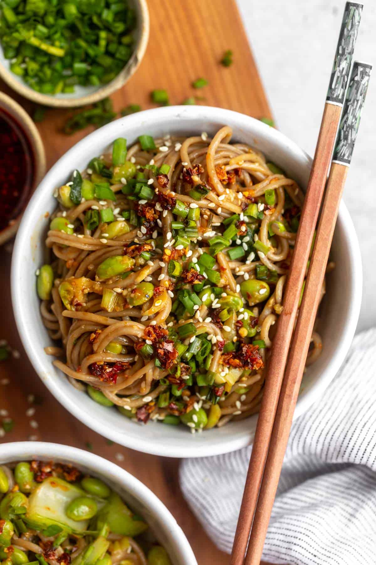sesame miso noodles in a bowl with chopsticks