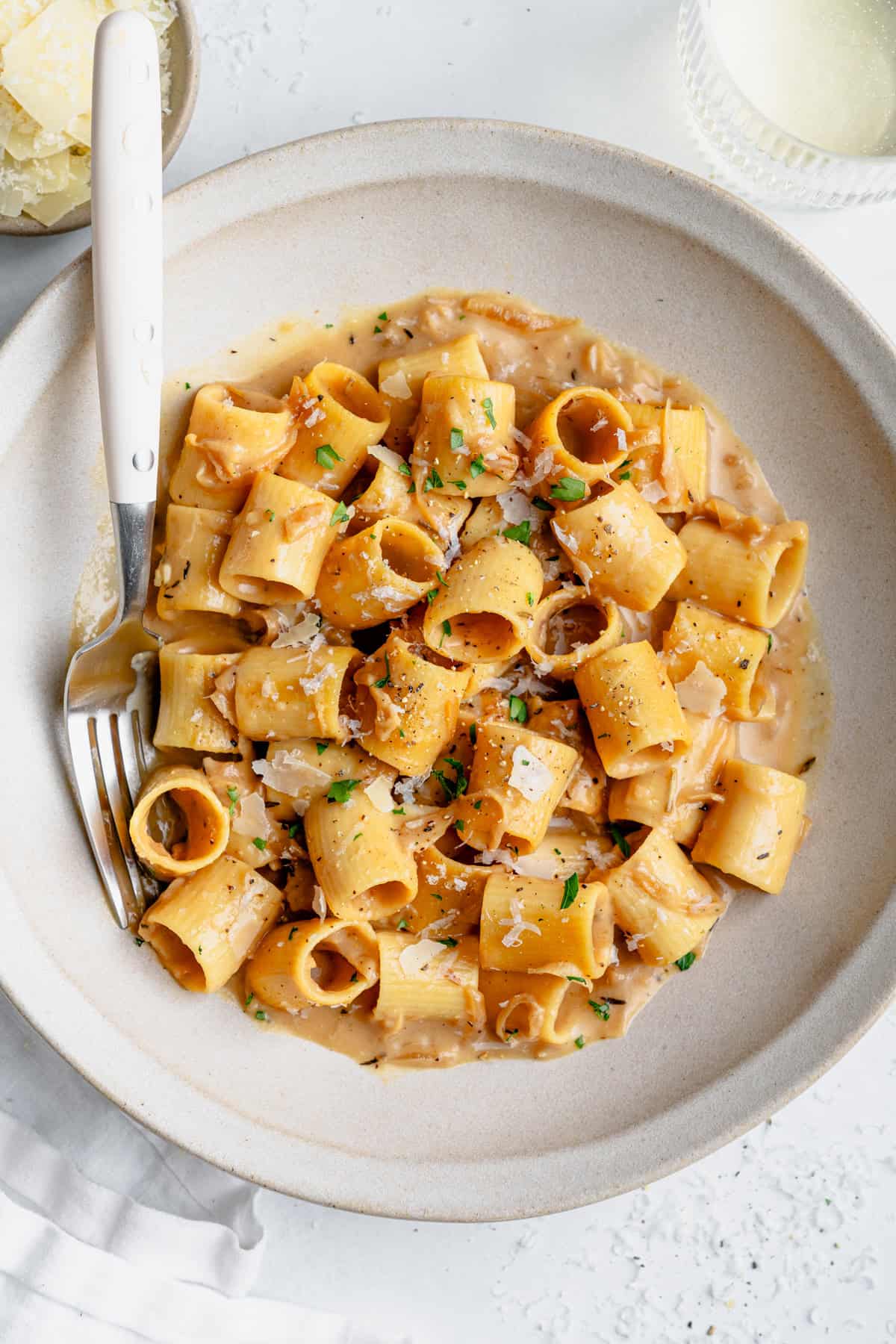 french onion soup pasta in a bowl with a fork on the side