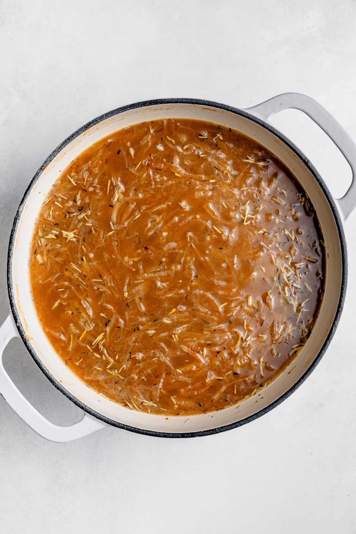 onion and broth simmering in a pot