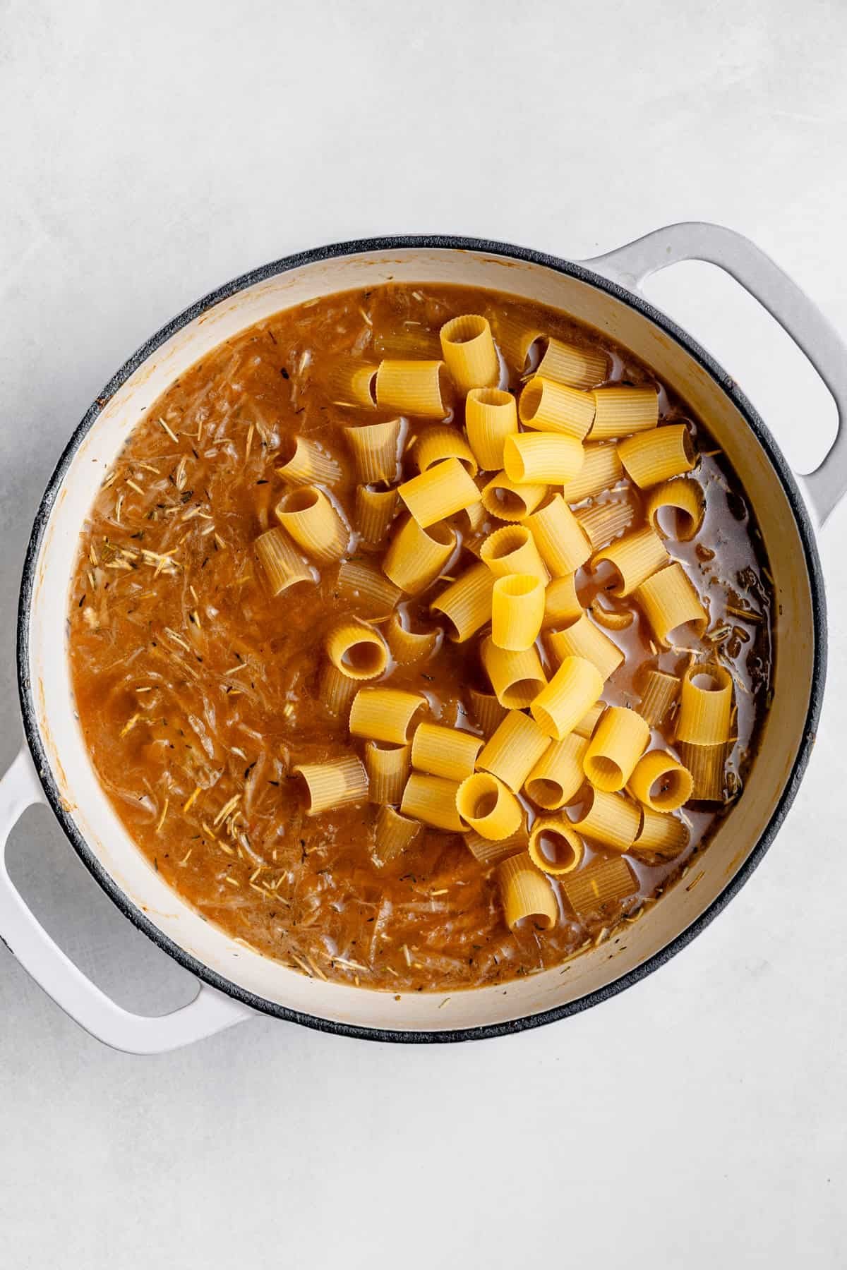 adding the pasta to the broth
