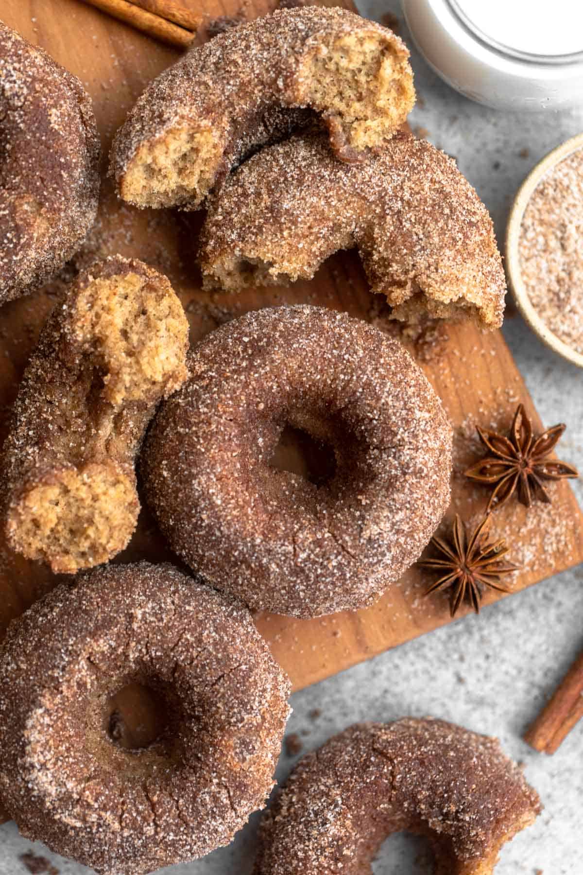 gluten free cinnamon sugar donuts on a wood board