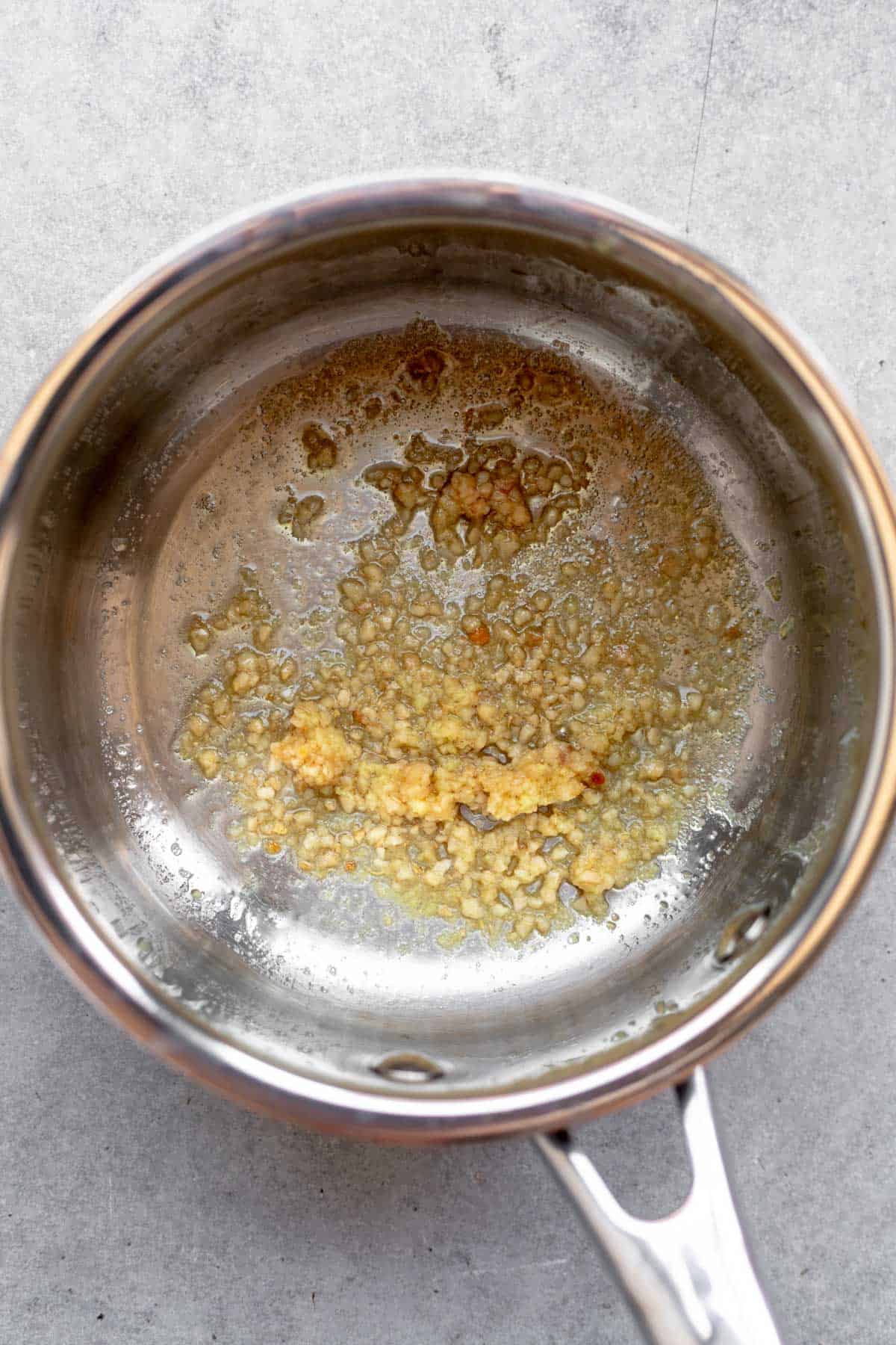 garlic sauteeing on the stove