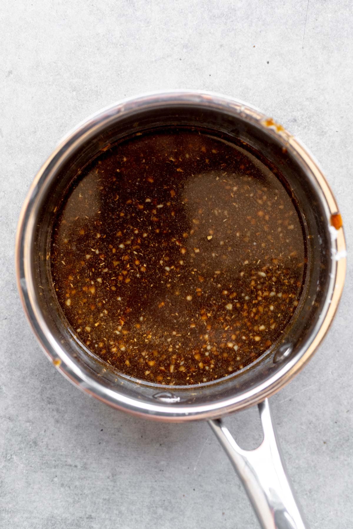 simmering the sauce on the stove