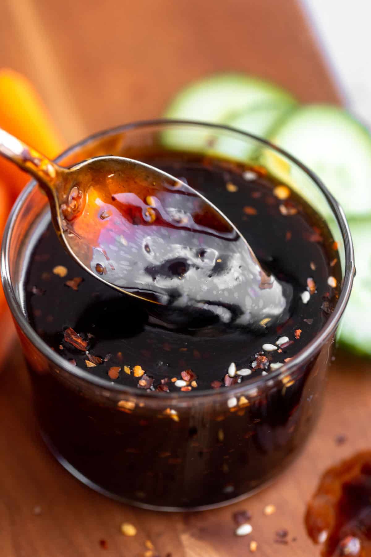 spoon in the cup of the gluten free teriyaki sauce