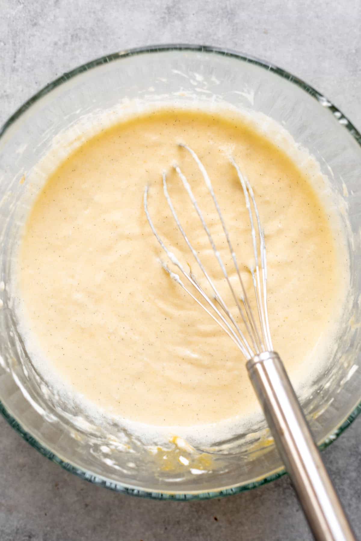 wet ingredients whisked in a glass bowl