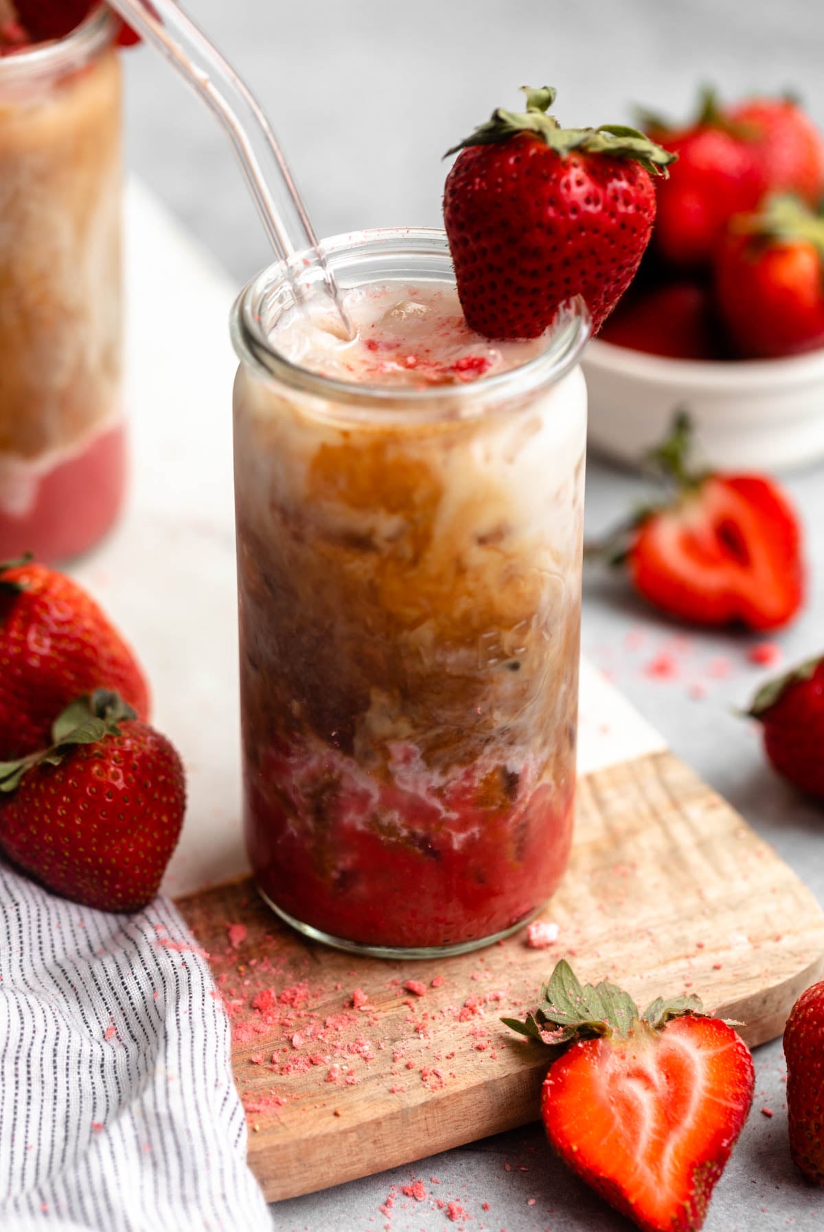 strawberry latte mixing together with the milk