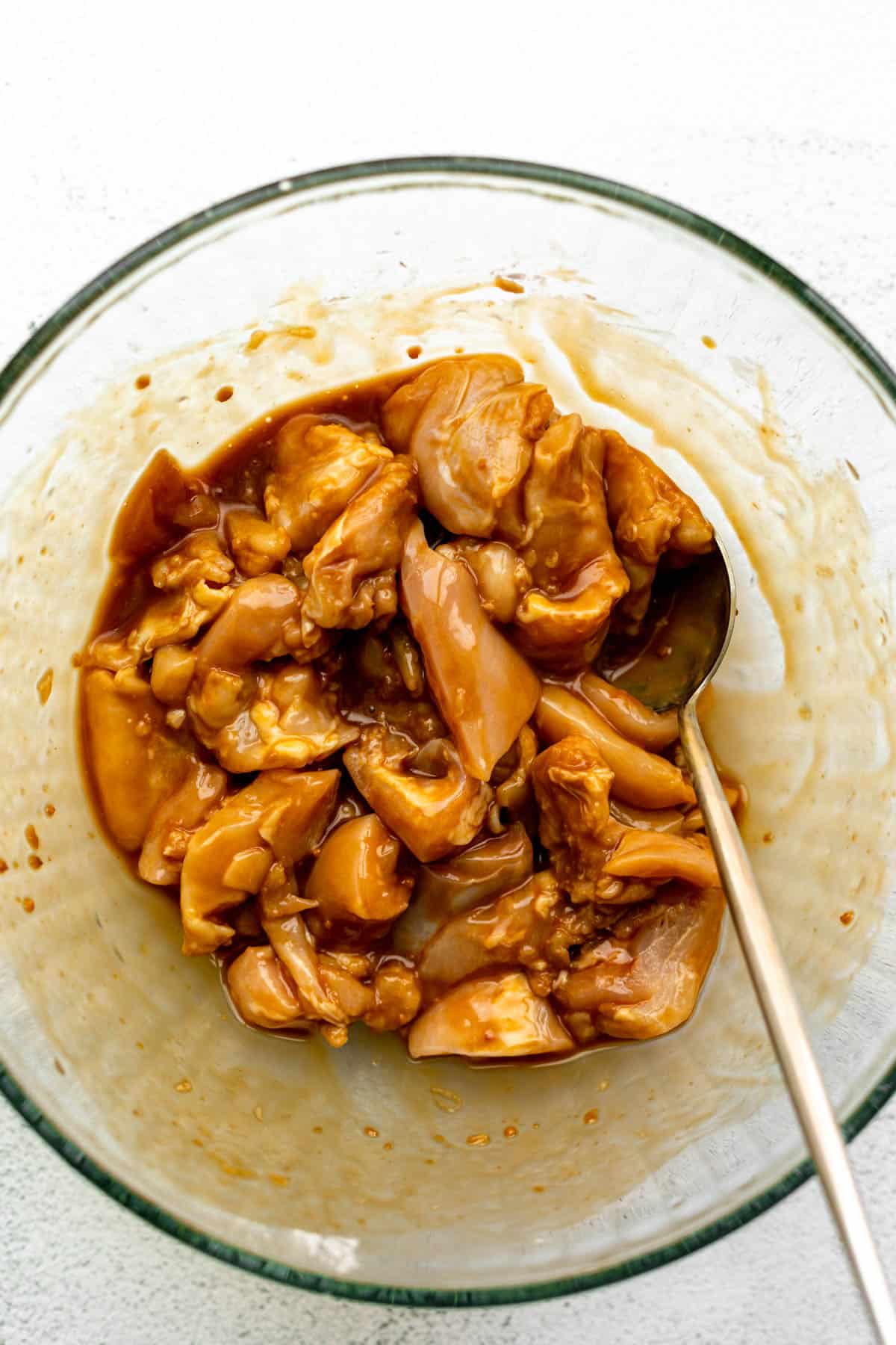 marinating the  meat in a bowl