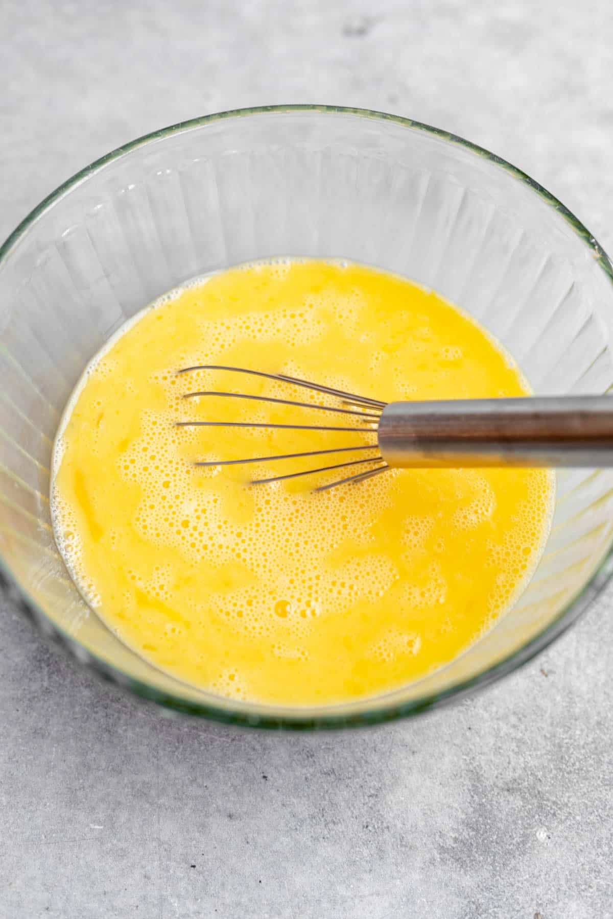 eggs whisked in a glass bowl