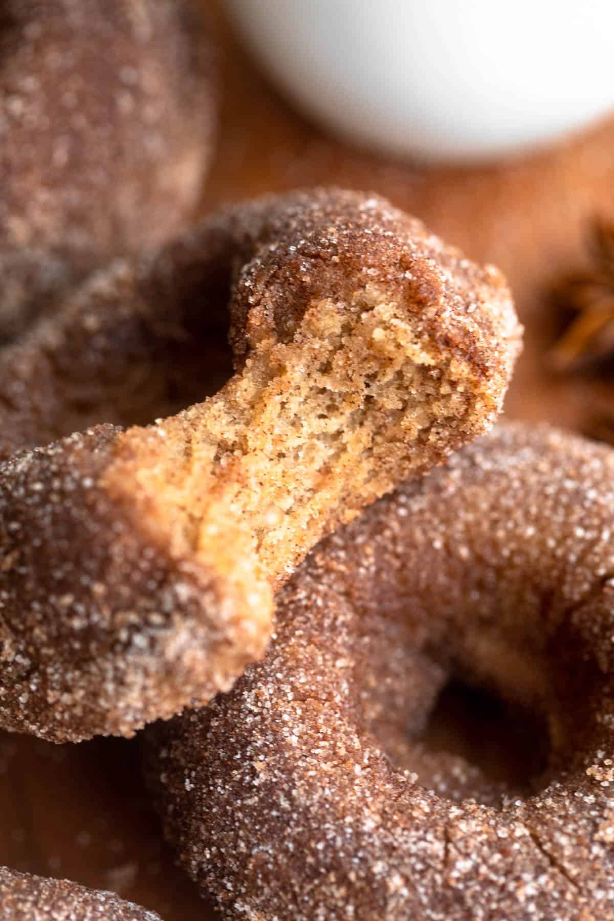bite taken out of the gluten free cinnamon sugar donut to show texture