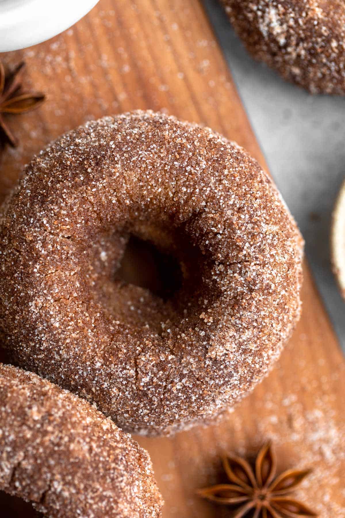 gluten free cinnamon sugar donuts on a wood board