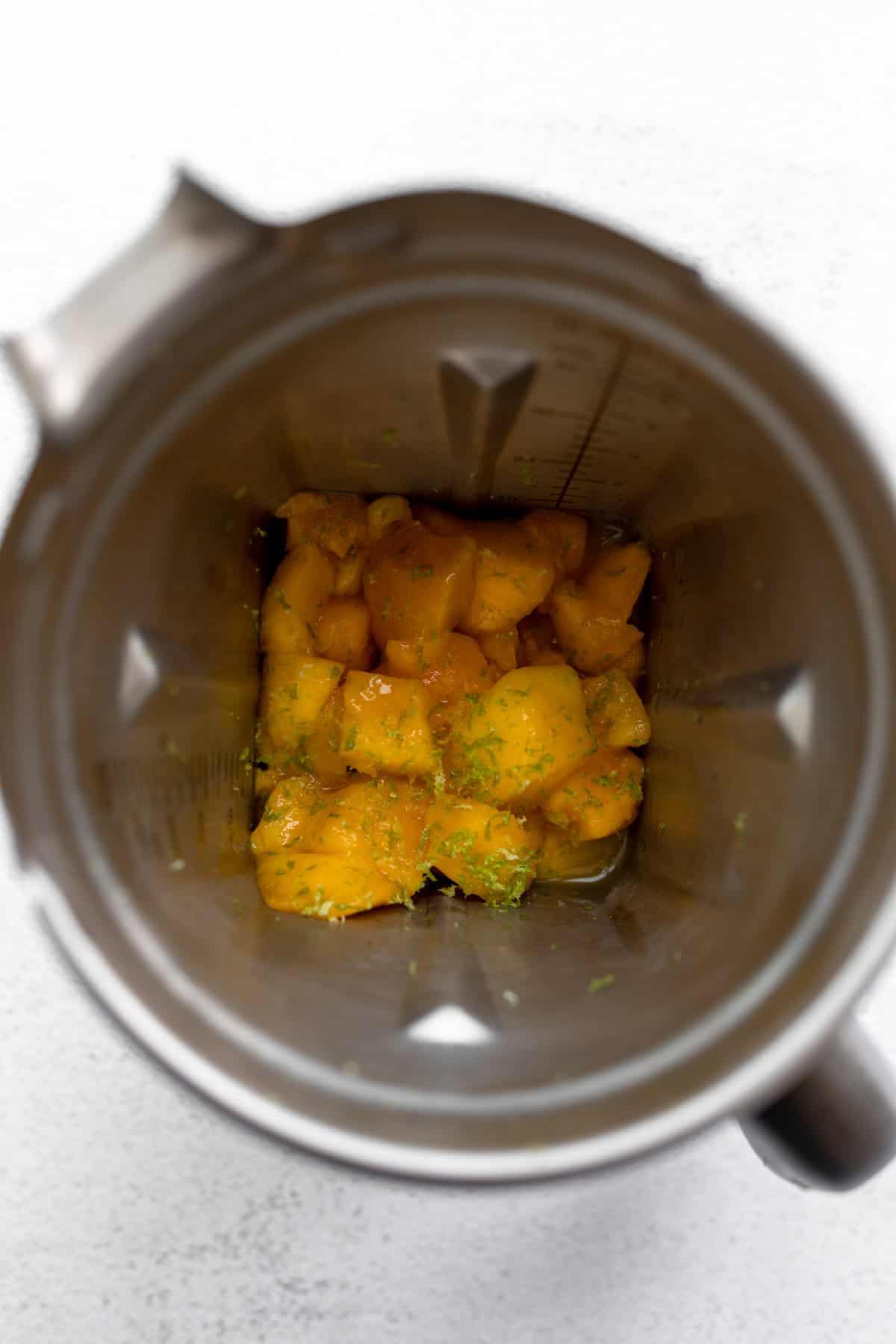 fruit in a blender with lime zest 