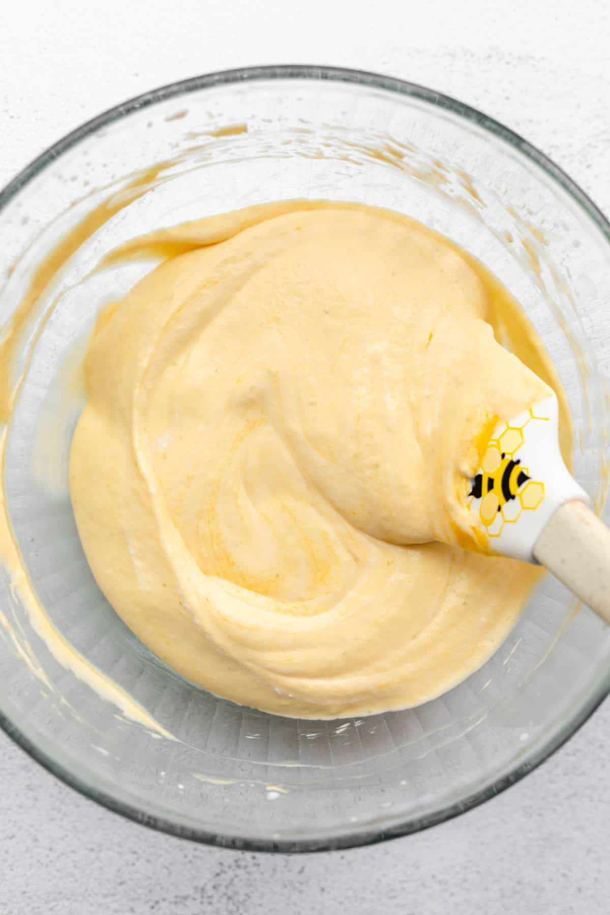 mango mousse in a glass bowl before going in the fridge