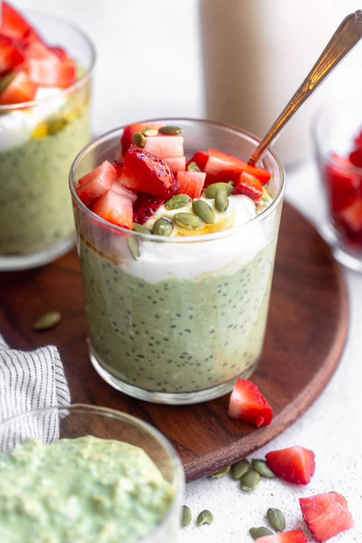 matcha overnight oats with greek yogurt and berries on top