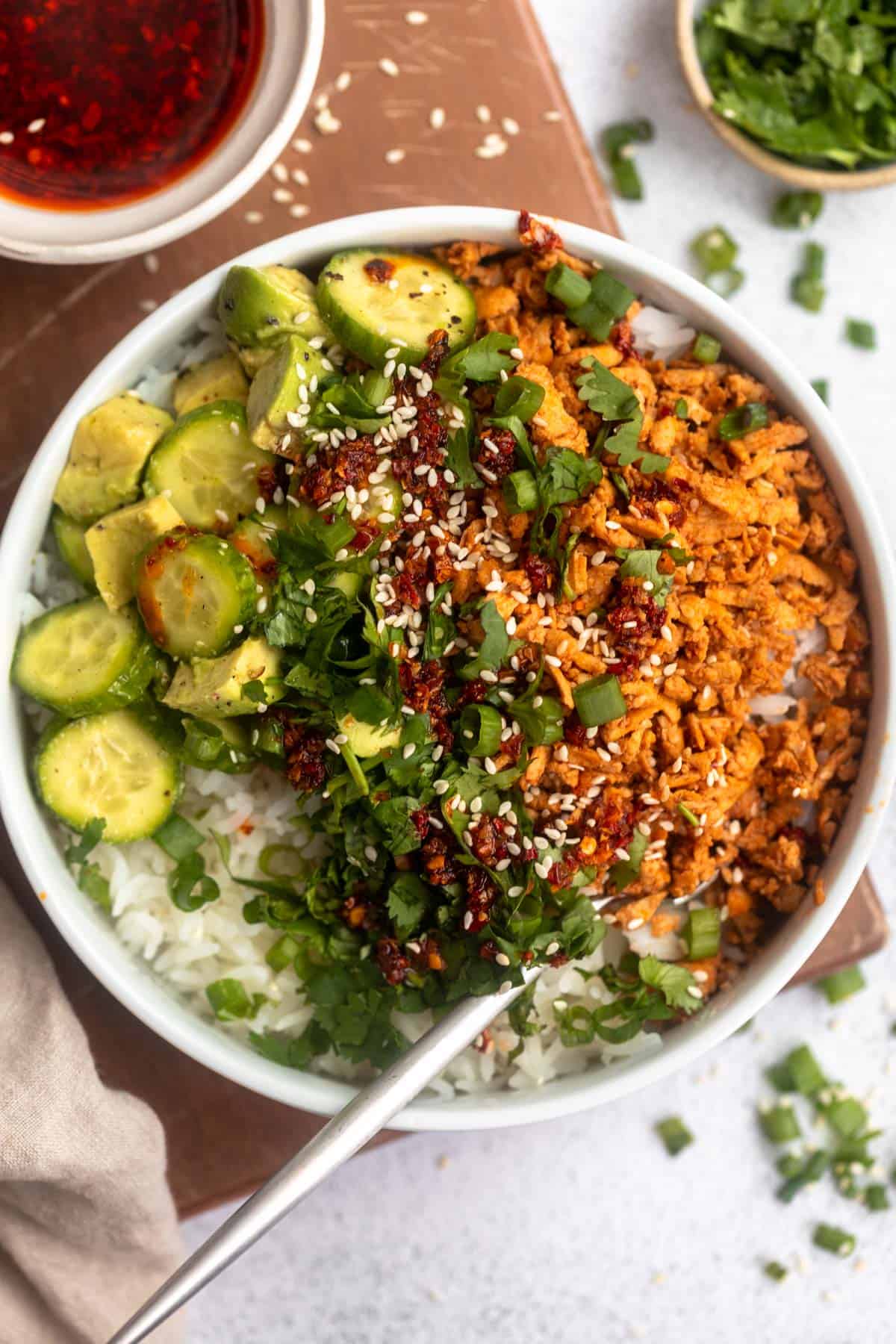tofu crumble bowls with cucumber avocado salad on the side