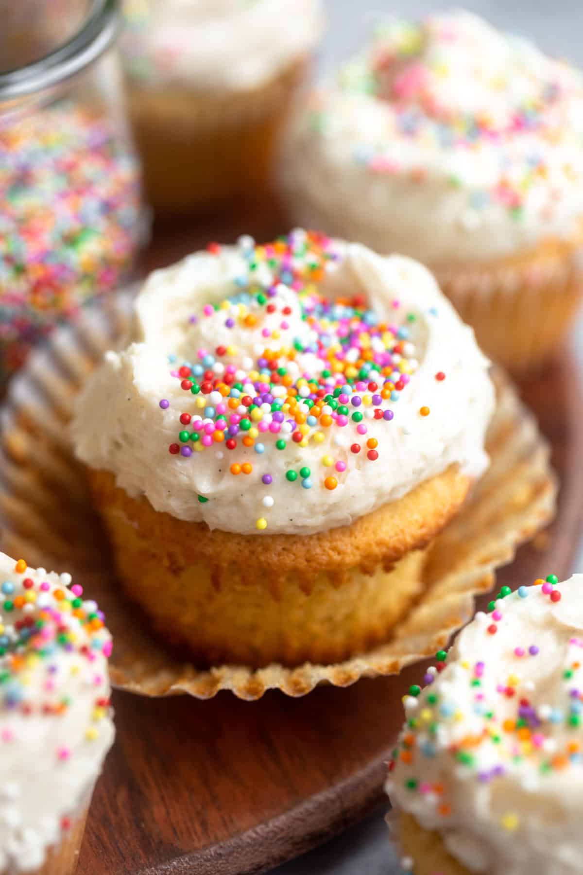 angled view of the almond flour vanilla cupcakes with sprinkles