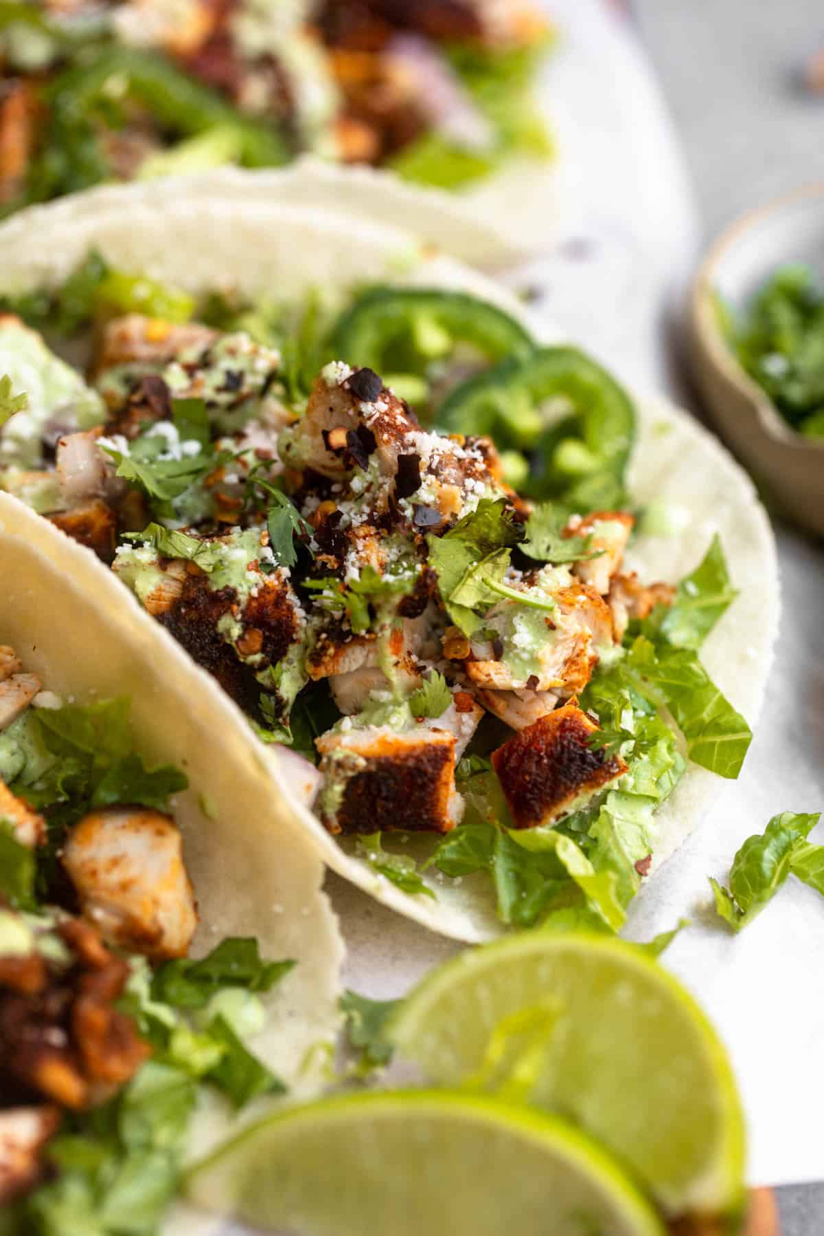 up close image of the chicken tacos to show crispy texture