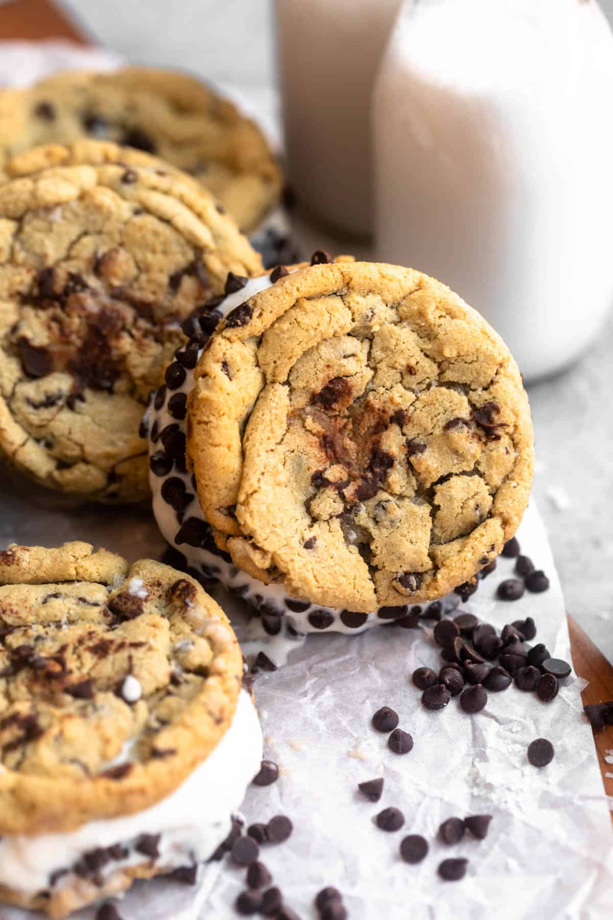 gluten free ice cream cookie sandwich with milk in the back
