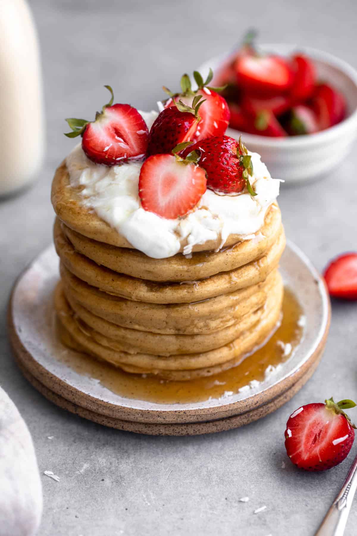 gluten free protein pancakes on a plate with berries