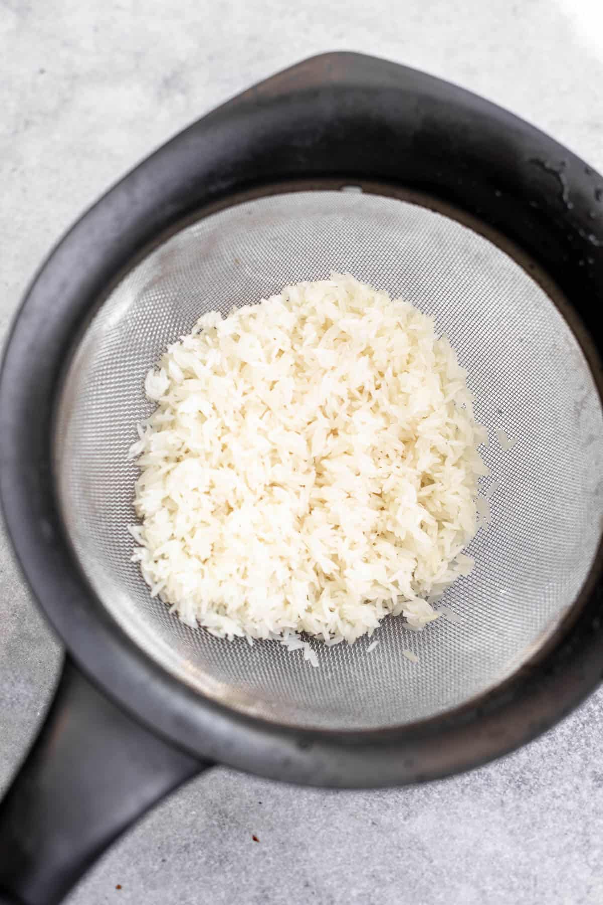 rinsing the grain in a strainer