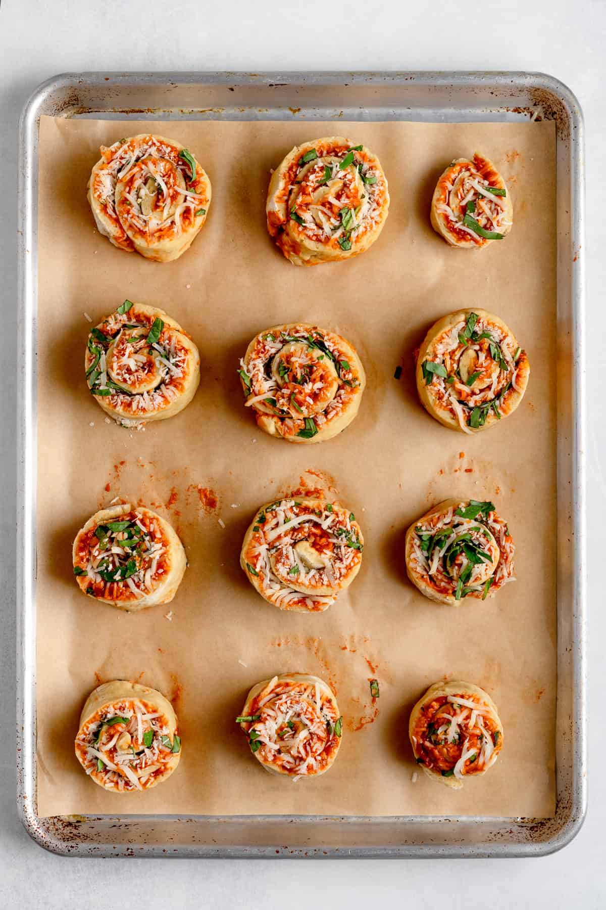 sliced pinwheels on a baking sheet