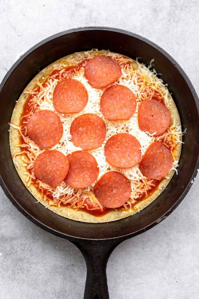 toppings in the pan before baking again