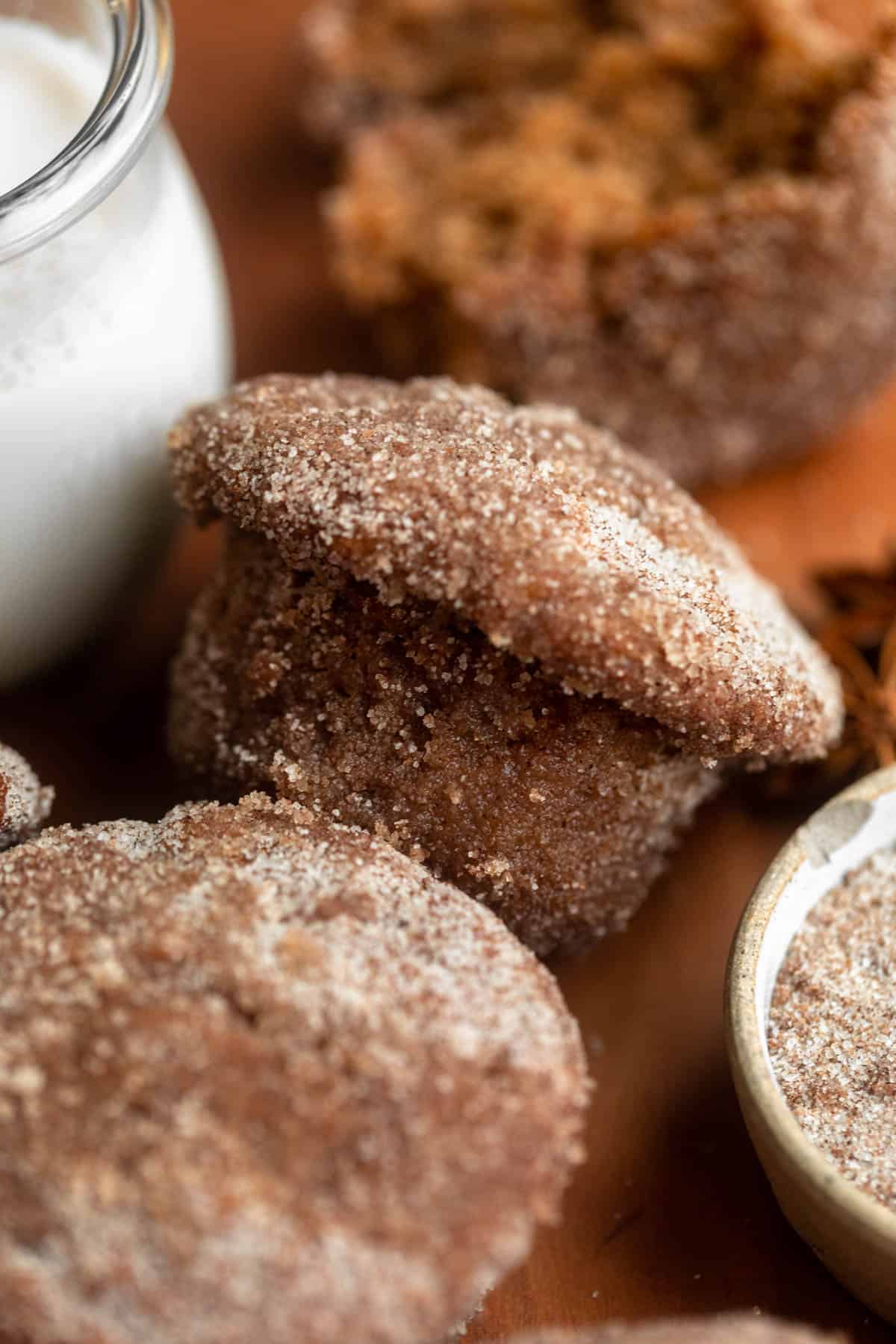 gluten free apple cider muffin on a wood board with cinnamon sugar