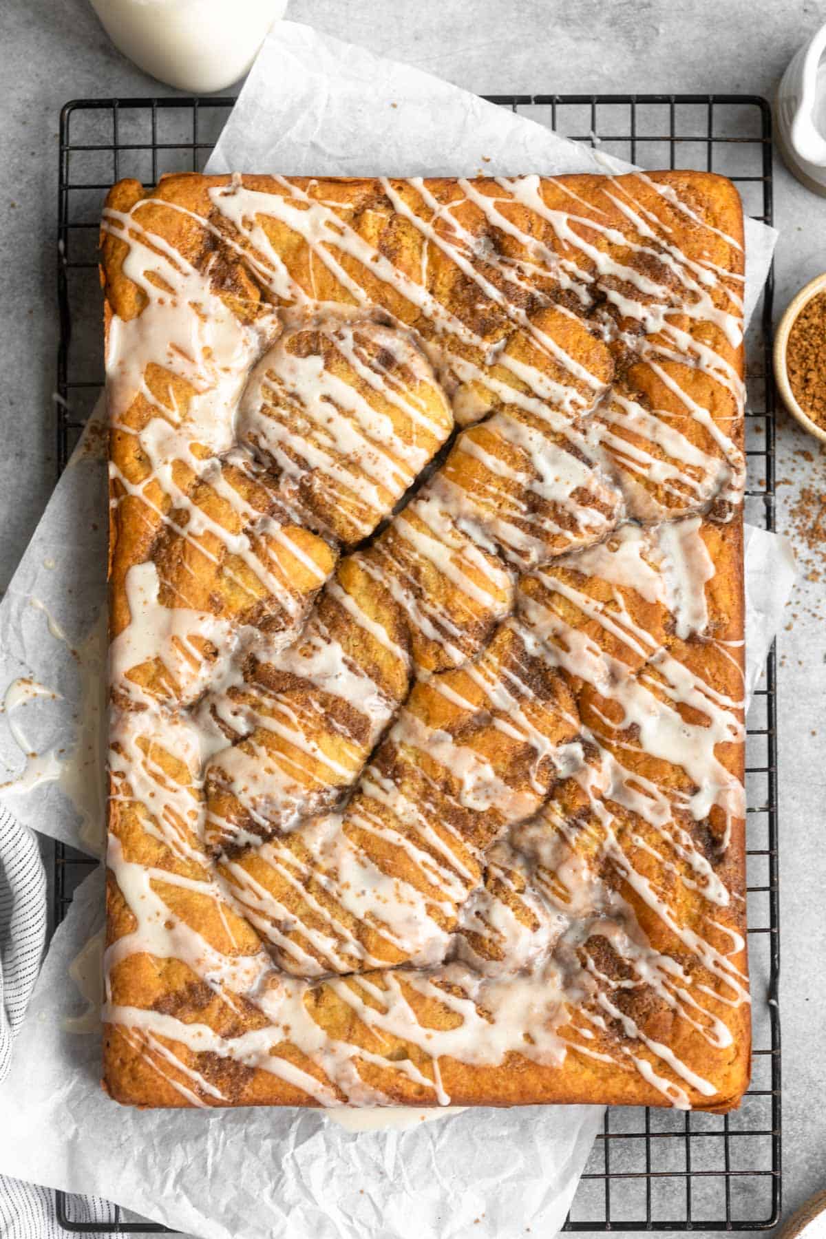 overhead shot of the gluten free cinnamon roll cake with icing on top
