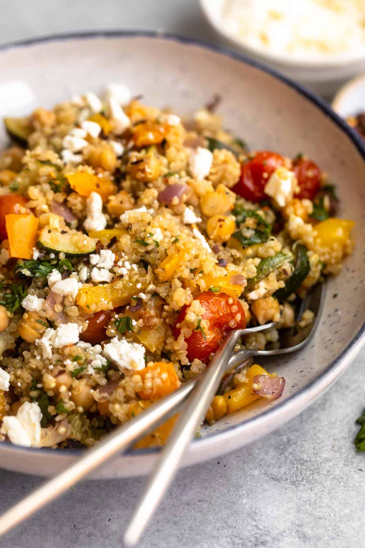 angled view of the roasted vegetable quinoa salad in a bowl