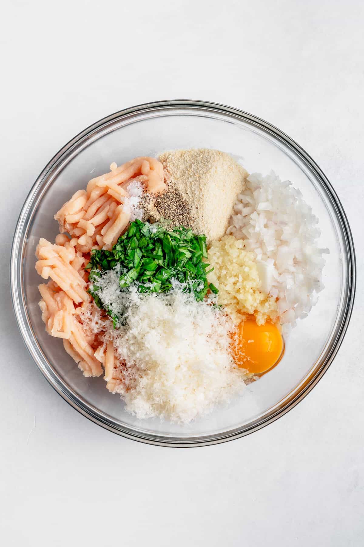 ingredients for the meatballs in a bowl