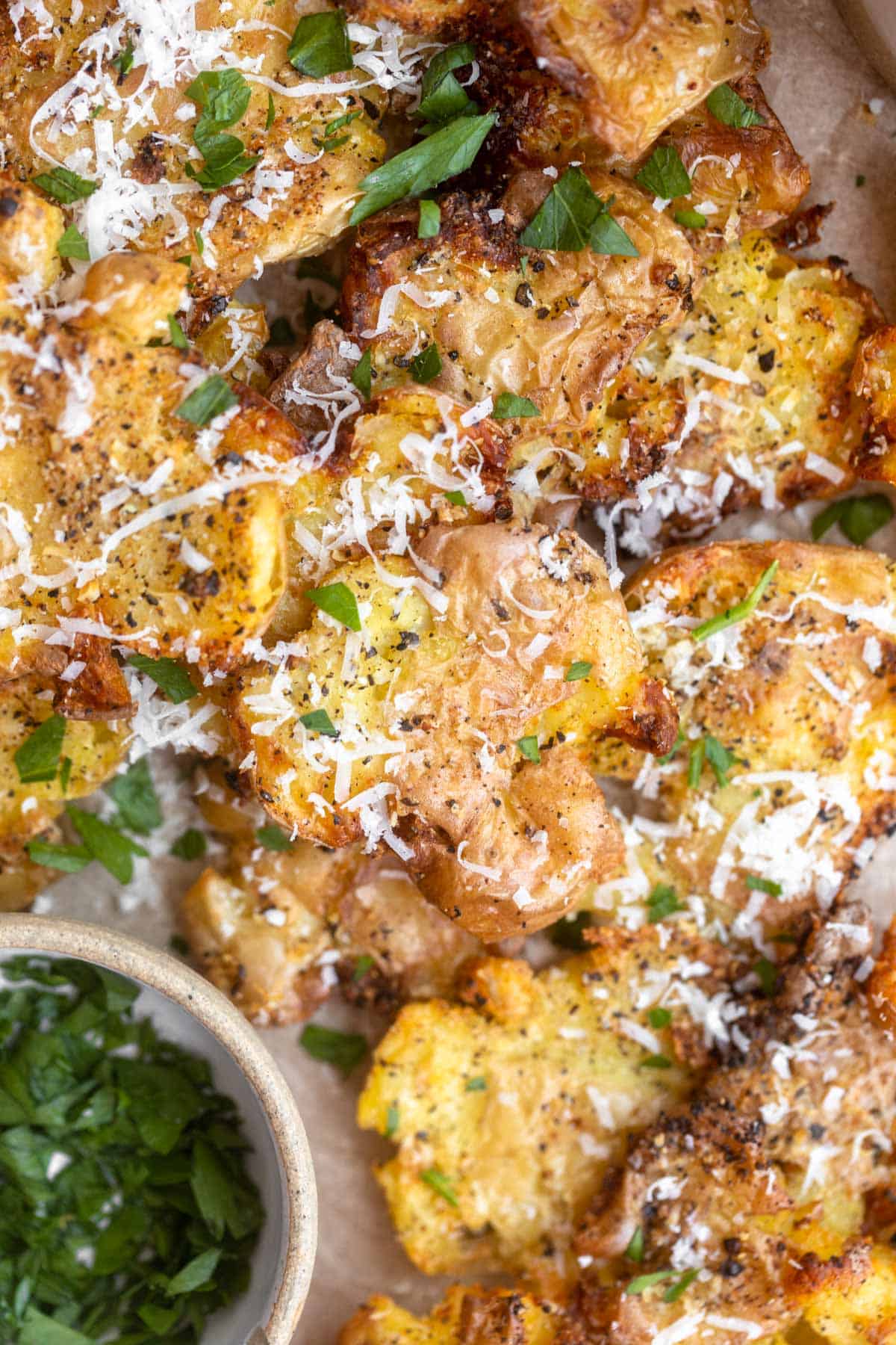 air fryer smashed potatoes with parsley on top