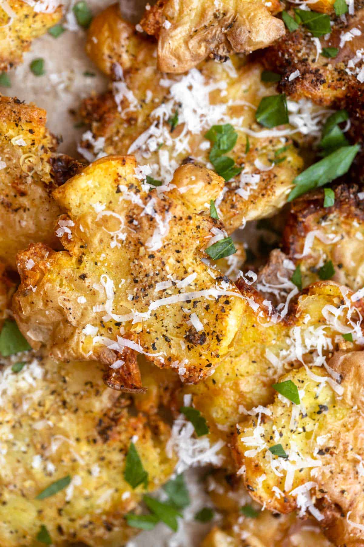 air fryer smashed potatoes with parmesan on top