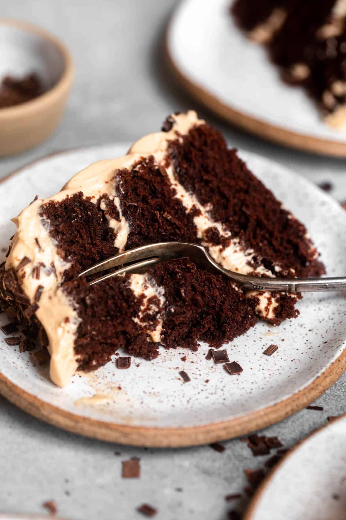 fork in a piece of the chocolate espresso cake on a plate