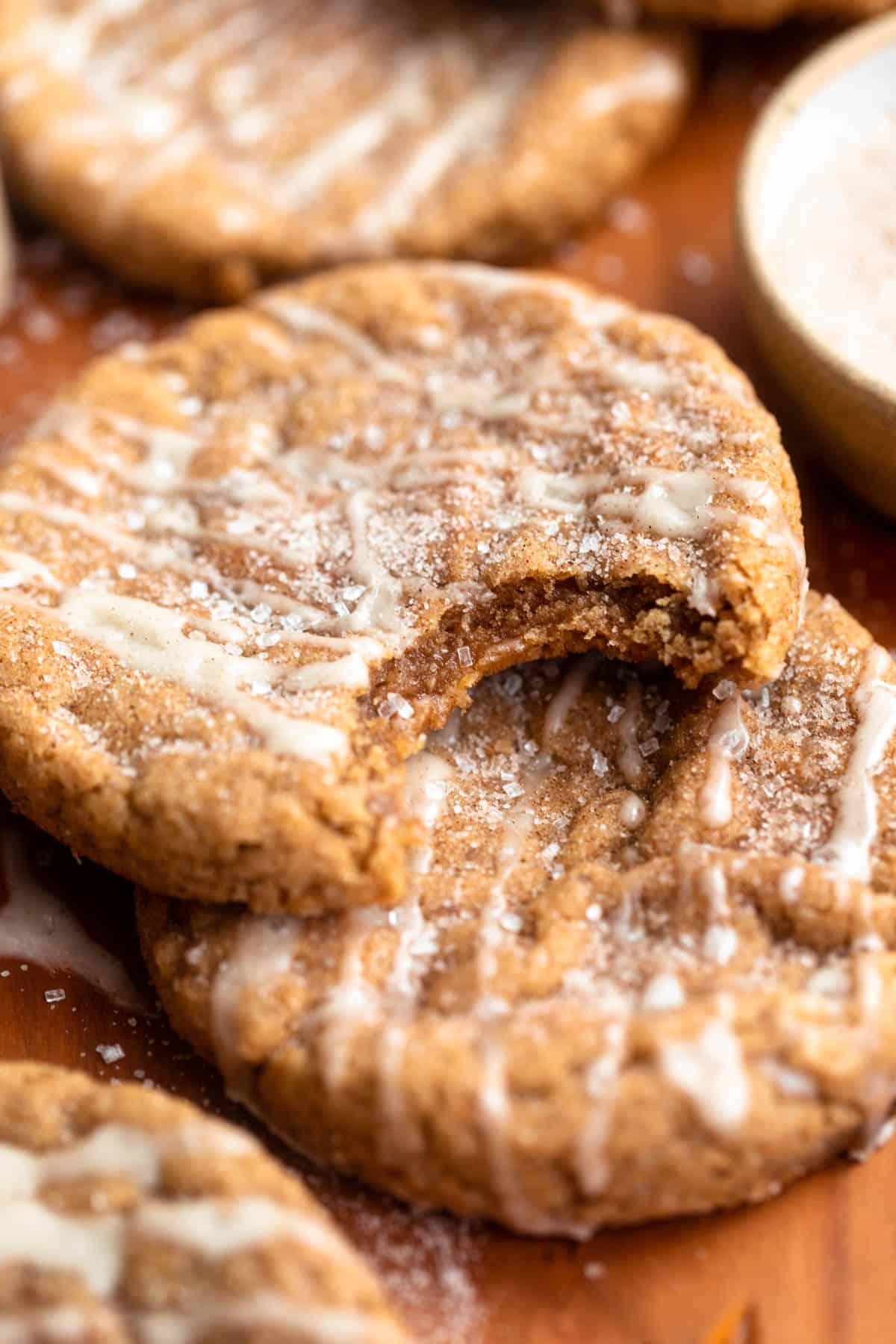 gluten free apple cider cookies with a bite taken out to show texture