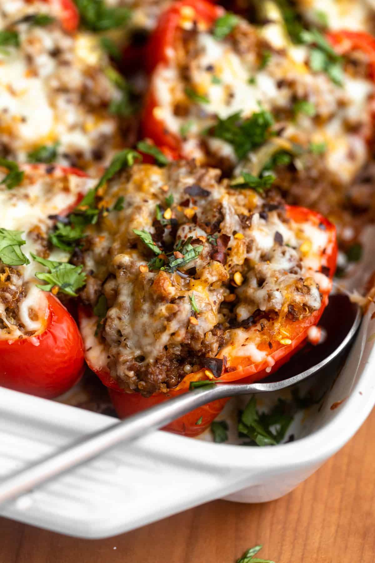 angled view of the gluten free stuffed peppers in a baking dish