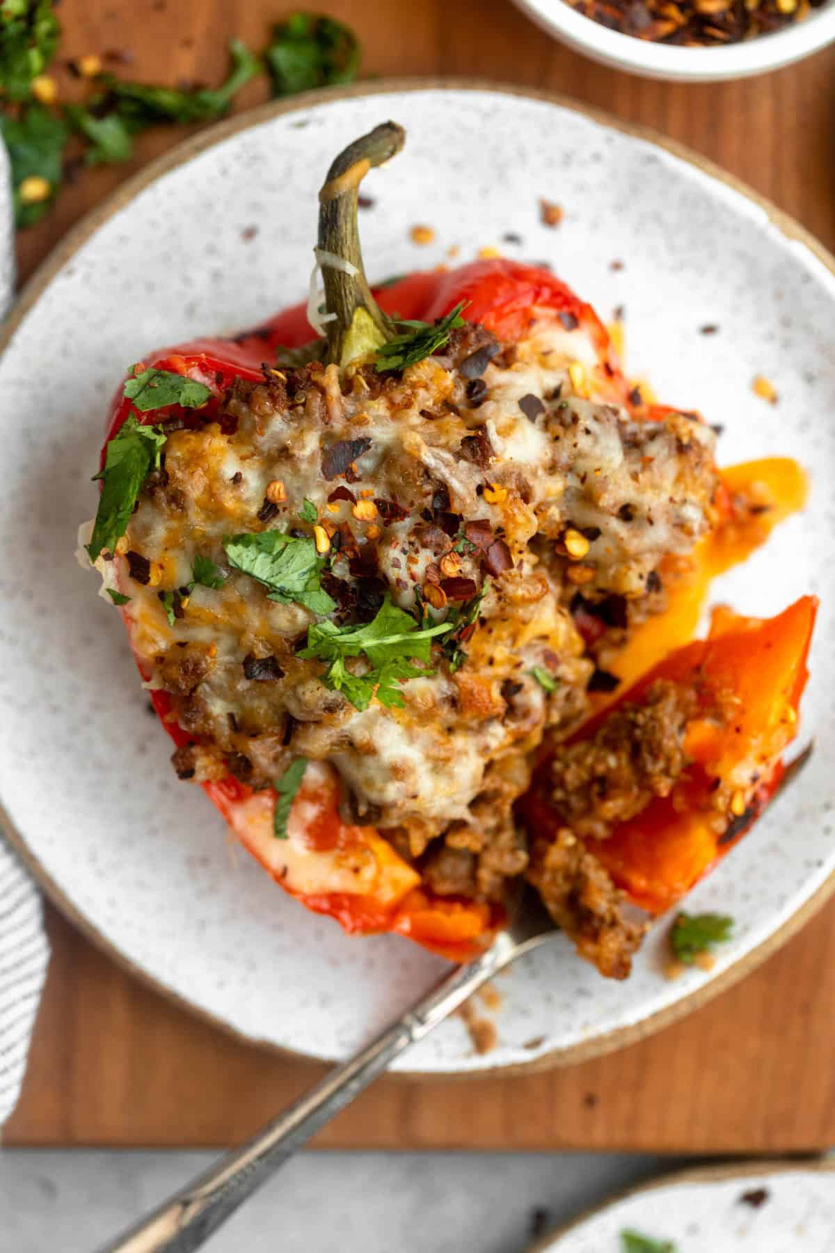 mexican gluten free stuffed peppers with a fork on the side