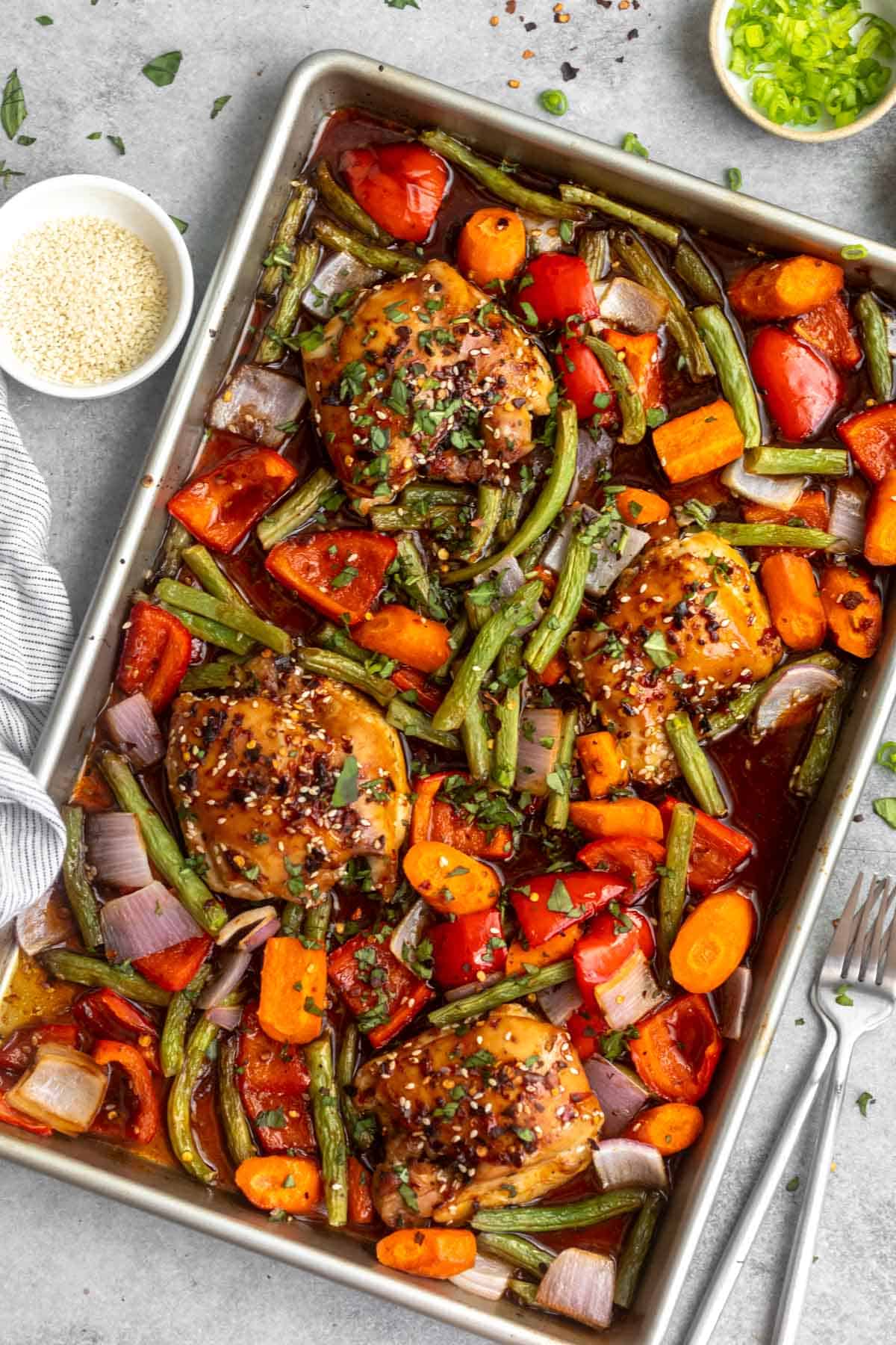 overhead shot of the sheet pan sesame chicken thighs with veggies