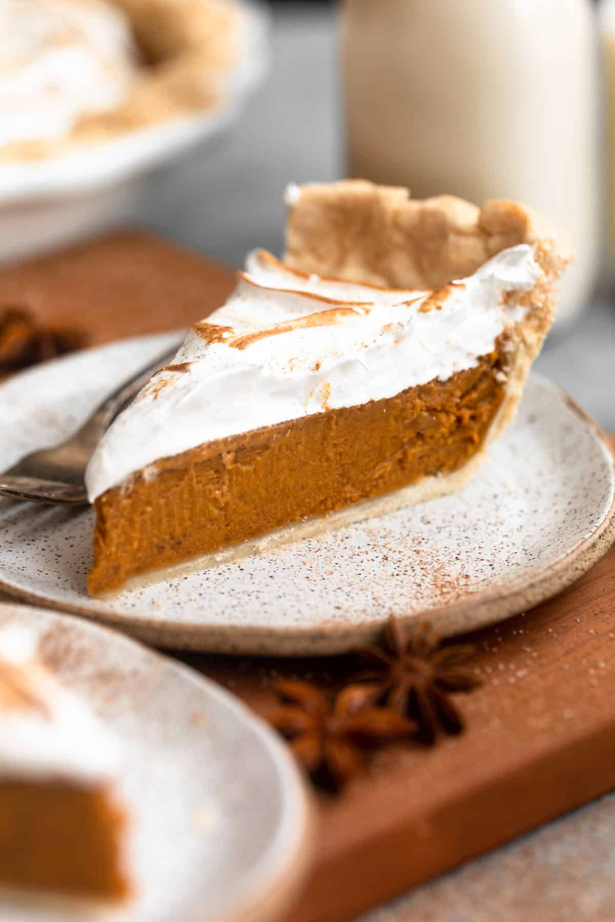 gluten free sweet potato pie on a plate with marshmallow meringue 