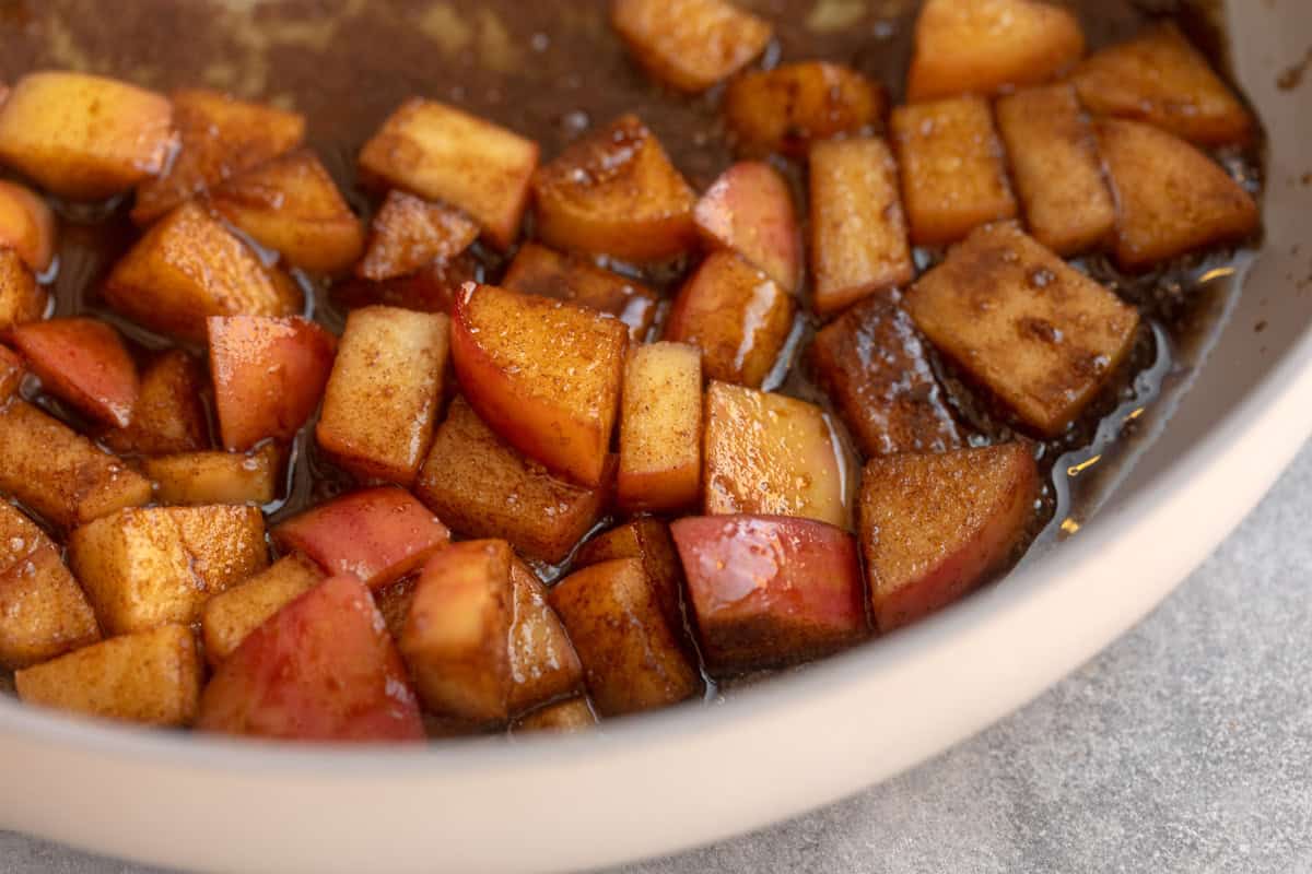 sauteed apples in a skillet with spices